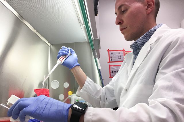 Jacob Yount conducts lab research at The Ohio State University College
