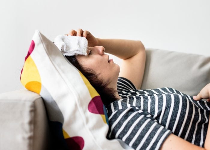 Woman with a cold and high fever