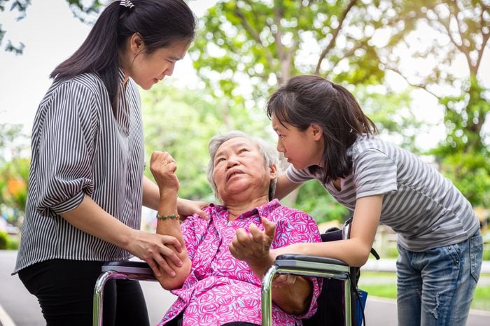 Sick senior grandmother with epileptic seizures in outdoor,elderly patient convulsions suffering from illness with epilepsy during seizure attack,asian daughter,granddaughter cry,family care concept