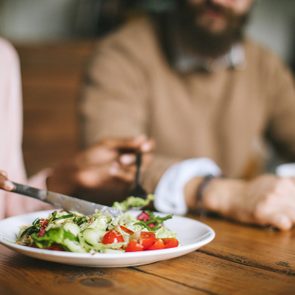 couple eating salad for dinner