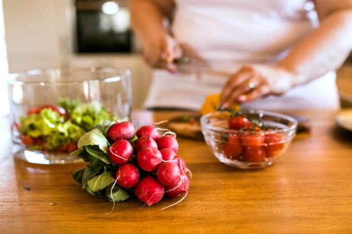 plant based diet preparing food in kitchen