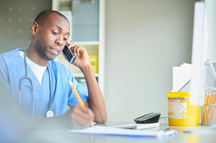male doctor on the phone with patient