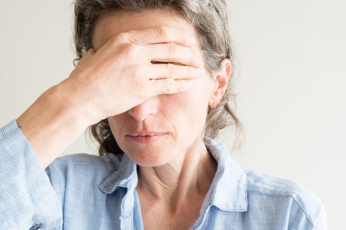 woman going through menopause symptoms
