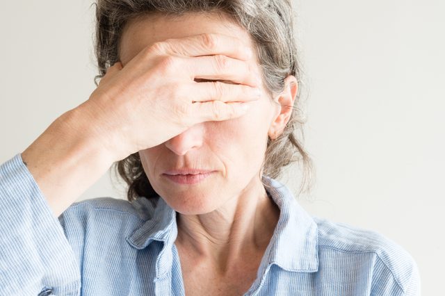 woman going through menopause symptoms