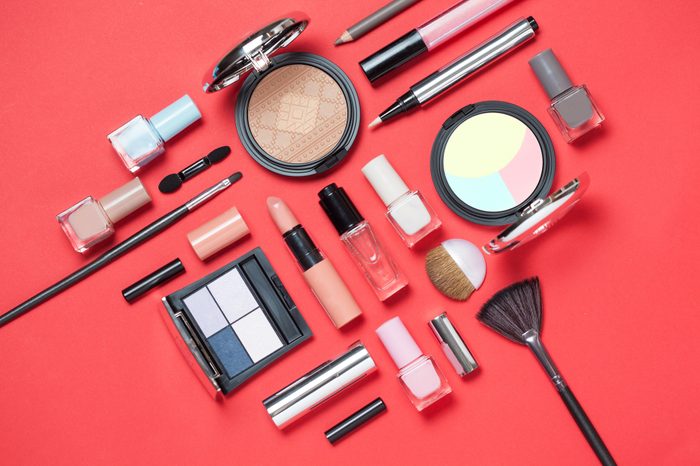 makeup cosmetics on red background