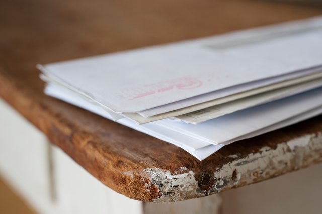 stack of mail on the table