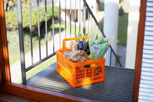 grocery basket outside of home door