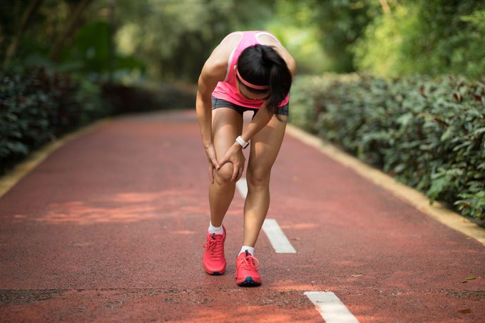 woman running with painful shin