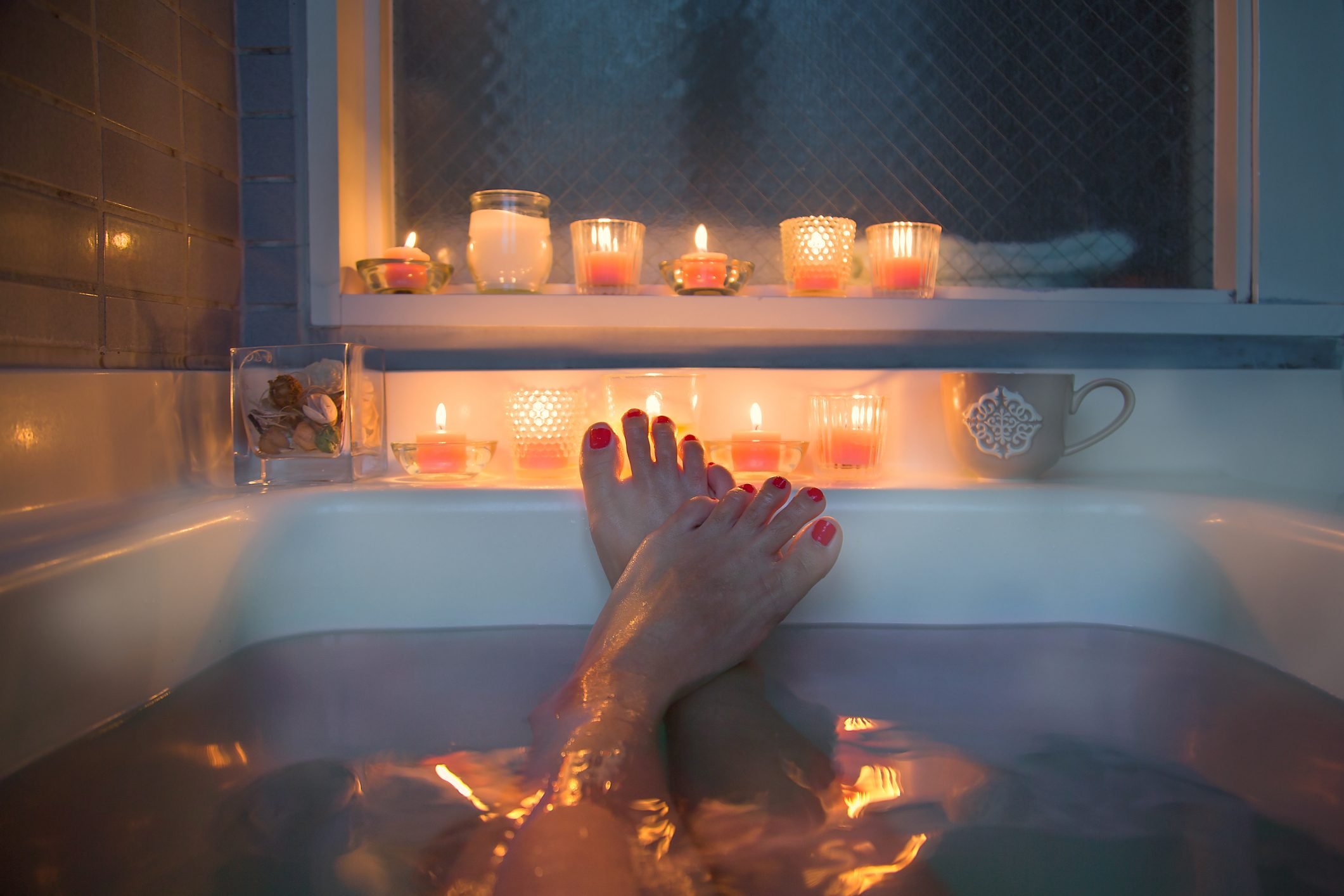 feet in bath at night time