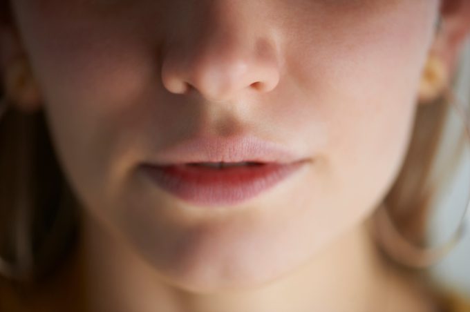 close up of woman's nose and mouth