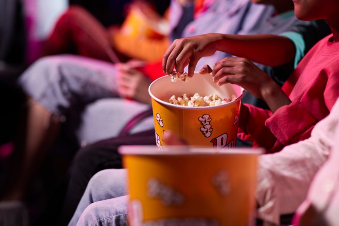close up of popcorn bucket in movie theater