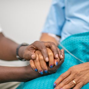close up of hands holding in hospital