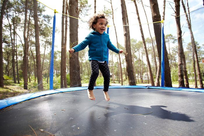 child jumping on the trampoline