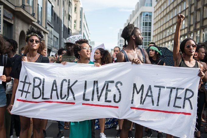 protestors holding black lives matter sign