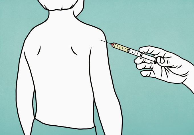 boy getting a vaccine in the arm illustration