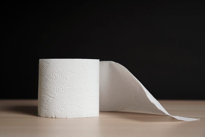 roll of toilet paper on black background