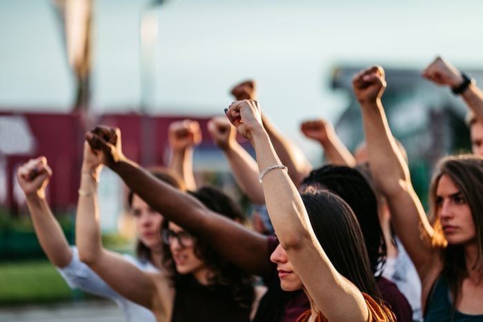 protestors raising fists for racial equality