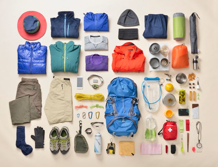 hiking gear essentials lay flat overhead