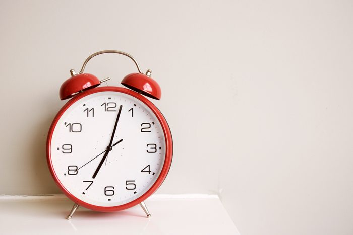 alarm clock on bedside table