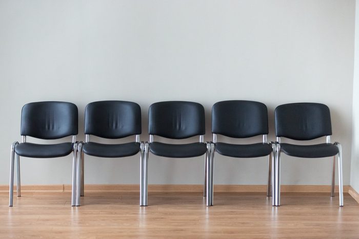 Row of black office chairs in conference room