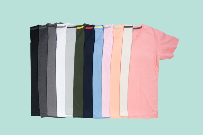 colorful t shirts on teal colored background