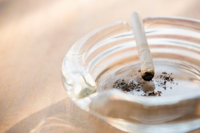 close up of ashtray with cigarette