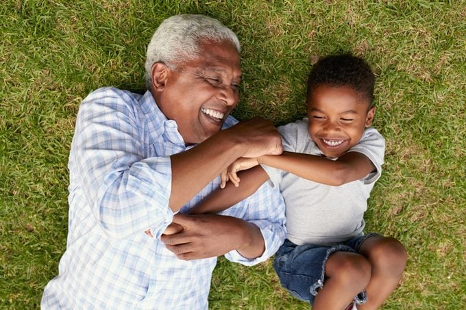 grandfather and grandson laughing together overhead