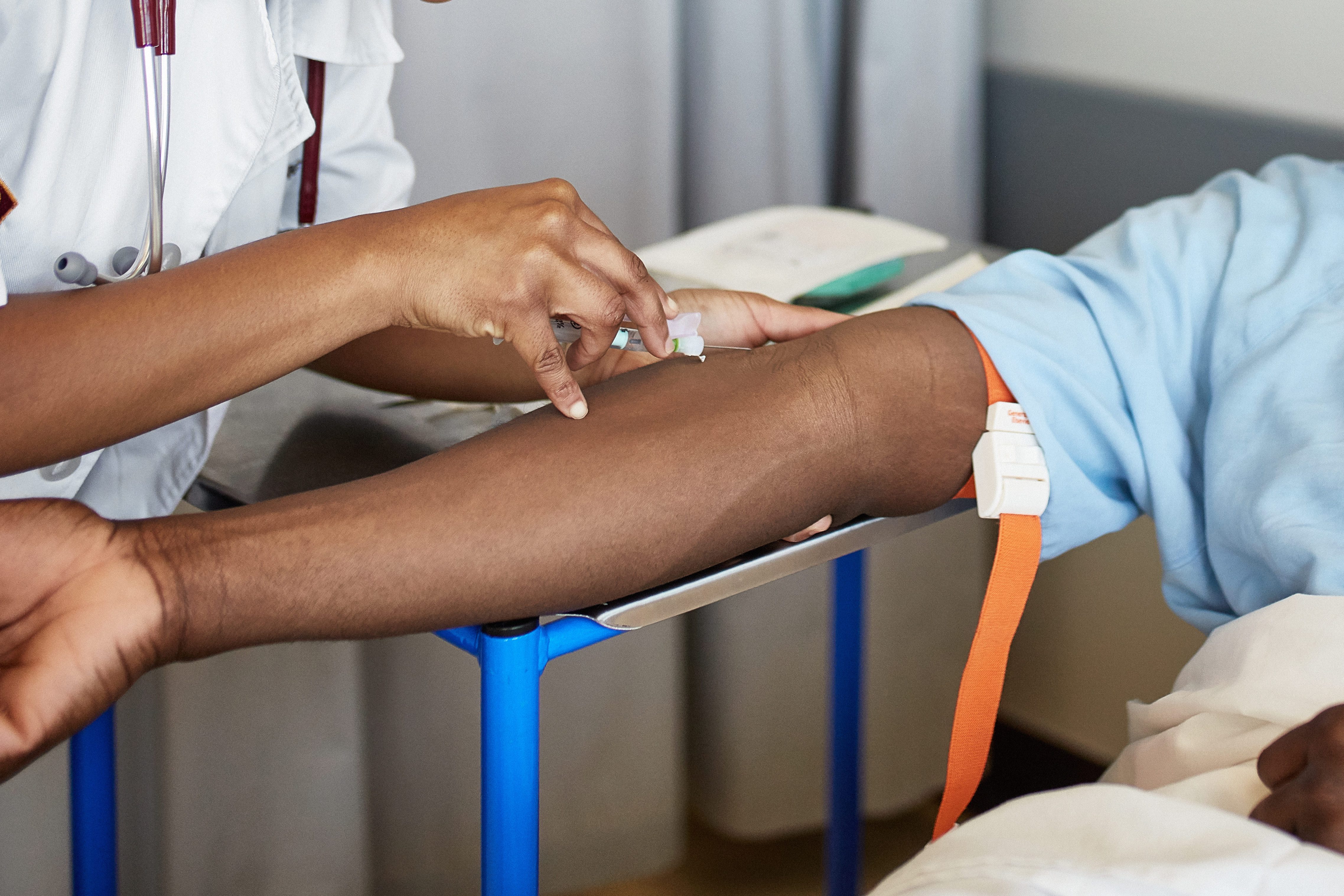 Medical Student Drawing Blood in Hospital