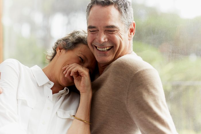 Cheerful mature couple at home