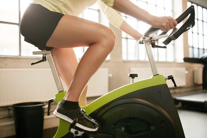  woman working out on exercise bike