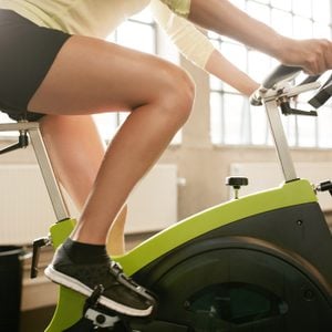 Fitness woman working out on exercise bike