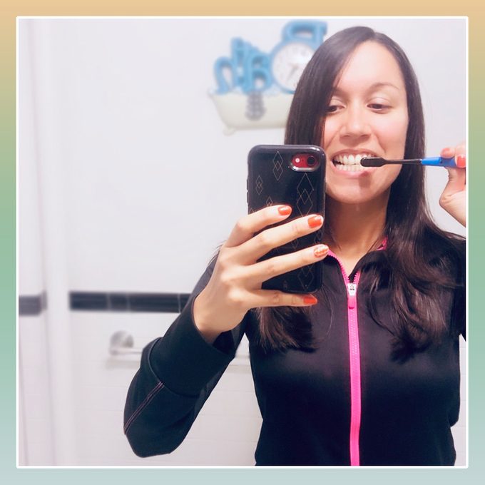 selfie of liz brushing teeth