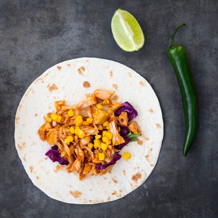 Wraps with marinated jackfruit, maize, red cabbage, coriander, lime and chili