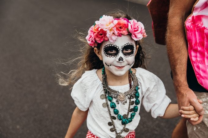 little girl dressed for Day of the Dead
