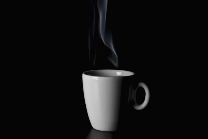 white coffee mug on black background
