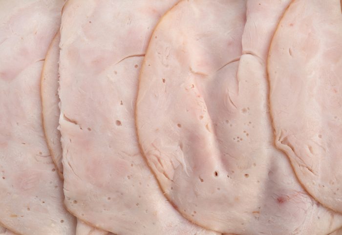 Close view of slices of oven roasted turkey breast luncheon meat