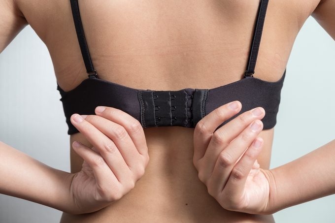 Woman adjusting bra straps