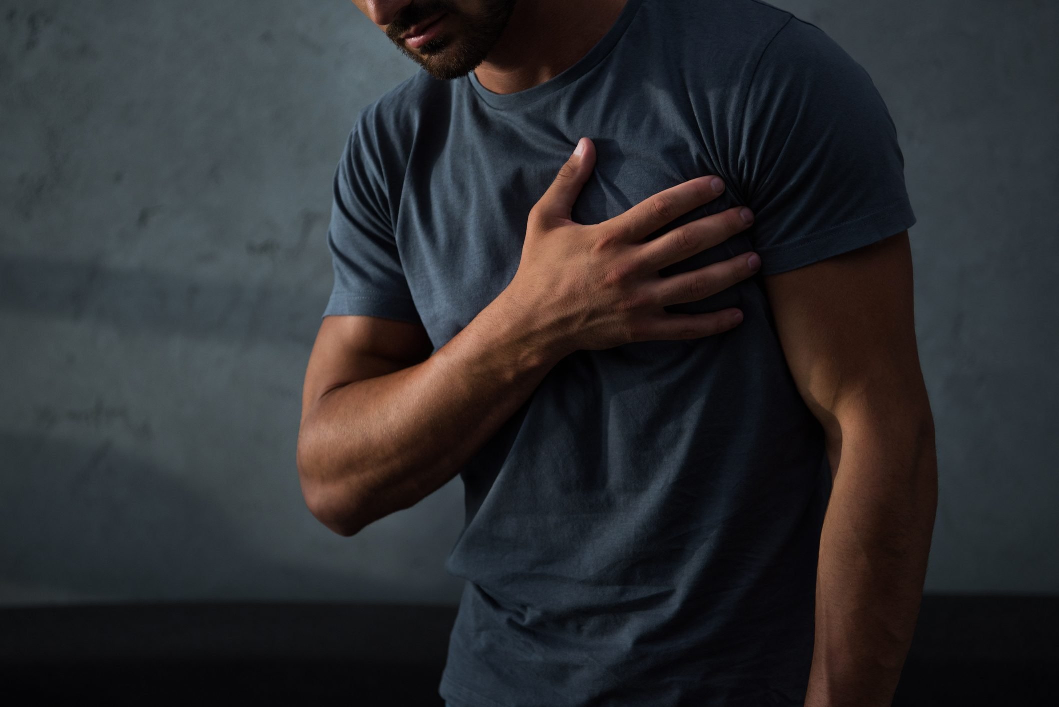 cropped view of man having chest pain and heart attack
