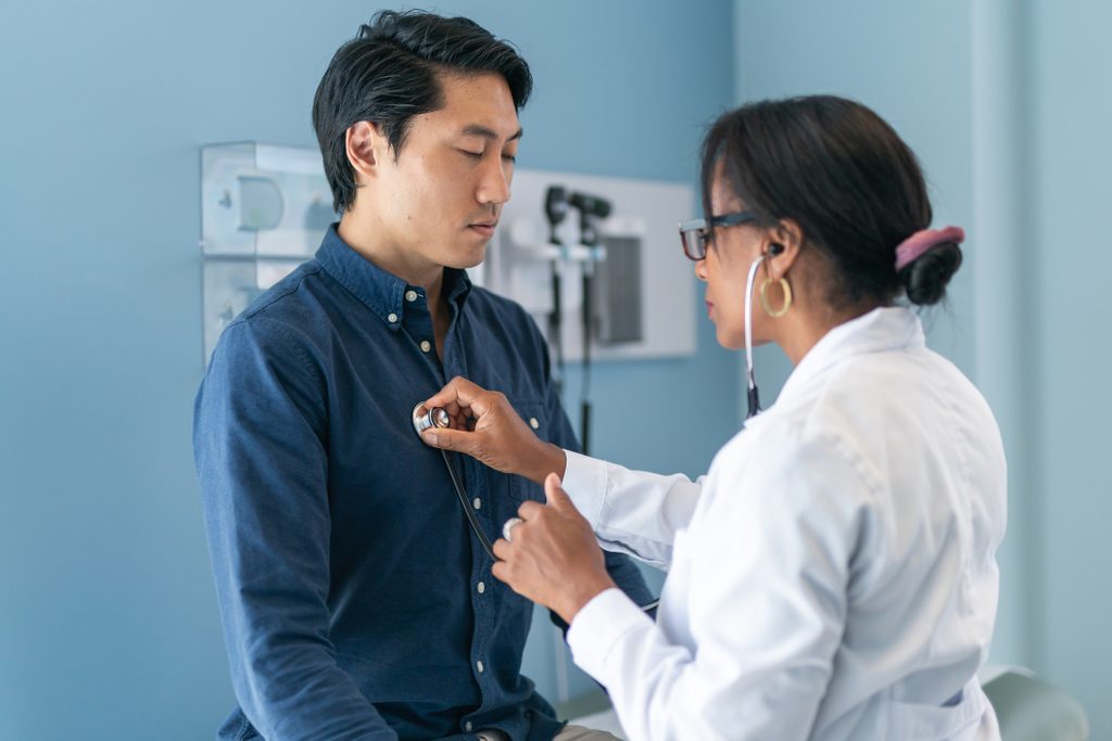 Korean man in consultation with doctor