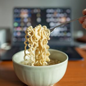 Eating instant noodle on a working table