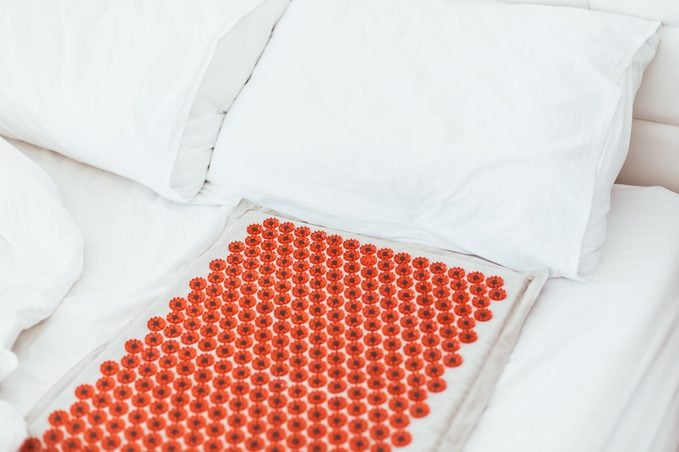 Acupuncture mat in the bed