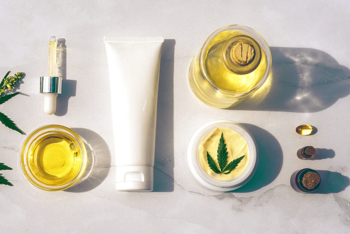 Cosmetics CBD Oil.  Cosmetic products with cannabis oil tincture flat lay
