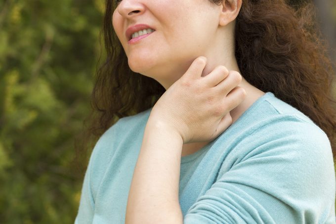 woman suffering itching scratching neck