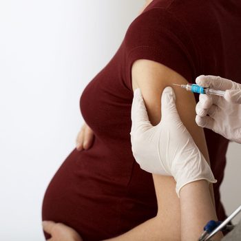 pregnant woman getting a vaccine shot