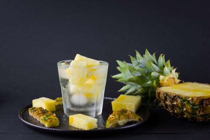 pineapple infused water on dark background