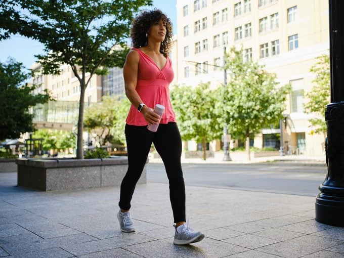 Young Adult Woman Walking outside for exercise