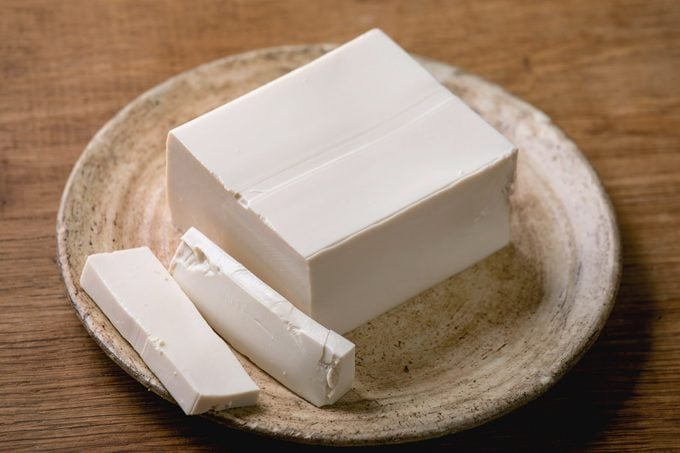 silken tofu on a plate on top of a wooden table