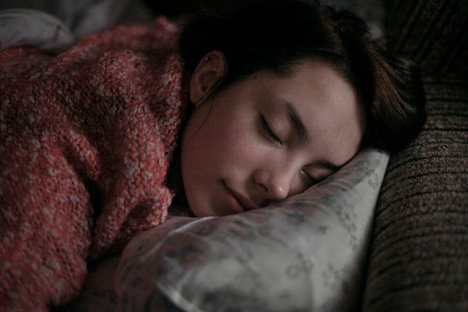 young woman sleeping at night