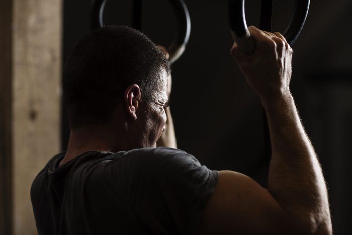 man training in dark gym