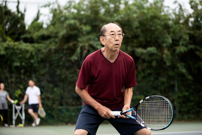 Senior man concentrating on tennis game